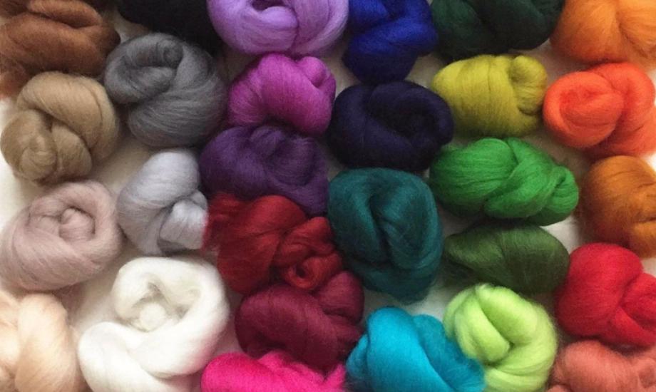 Balls of merino felting wool in different colours 